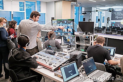 Group of operators broadcasting online conference Editorial Stock Photo