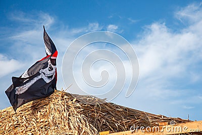 A skull and crossbones pirate flag waving in the wind., Jolly Roger, Pirates flag Editorial Stock Photo