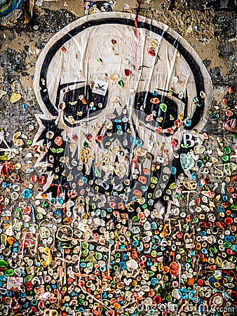 Skull sticker on Seattle Pike Place Market Gum Wall Editorial Stock Photo