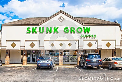 Skunk Grow Supply - Medical Marijuana Dispensary in strip mall with cars parked in front in Tulsa OK Editorial Stock Photo