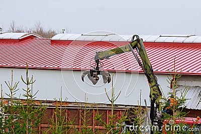 Skutec, Czech Republic, 21 November 2019: A grapple truck loads scrap industrial metal for recycling. Editorial Stock Photo