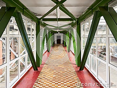 Sky bridge or transition between buildings at chemical plant above the ground high-altitude crossing saving time for workers tile Stock Photo