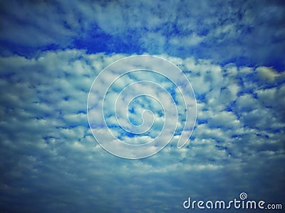 Sky with clouds. Meteorology, climate.Sky with clouds.White, fluffy clouds in blue sky.Sun rays and clouds. Stock Photo