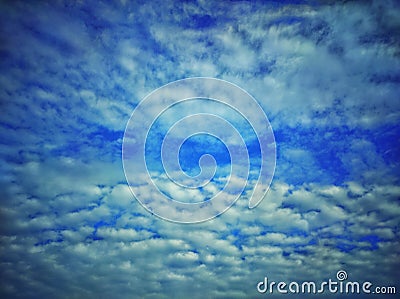 Sky with clouds. Meteorology, climate.Sky with clouds.White, fluffy clouds in blue sky.Sun rays and clouds. Stock Photo