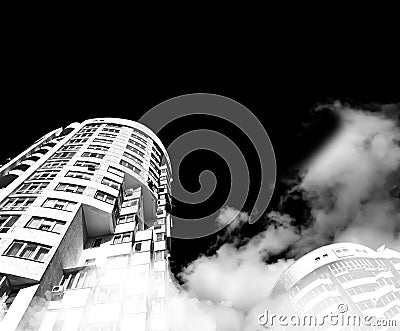Sky and clouds reflection in skyscrappers. Building from below. Blsck and white concept Stock Photo