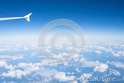 Sky and clouds seen from plane window. Atmosphere, stratosphere, air. Cloudscape, weather, nature. Wanderlust, adventure, discover Stock Photo