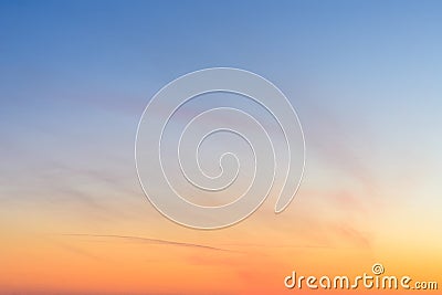 Sky and clouds at sunset, abstract colorful background, orange and blue. Stock Photo