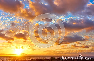 Sky with clouds above the Atlantic Ocean at sunset Stock Photo