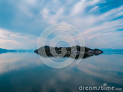 The sky colors reflecting in the Skadar lake Stock Photo