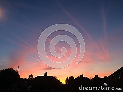 Sunset Sky With Condensation Trails Stock Photo