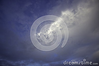 The sky is full of clouds and there is light in the middle Stock Photo