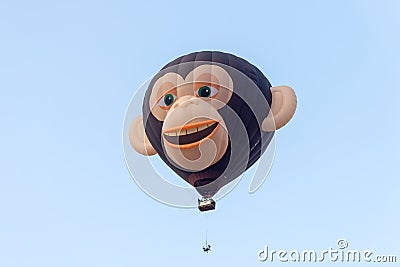 In the sky hot air balloon in the shape of head of a monkey withIn the sky hot air balloon in the shape of head of a monkey with t Editorial Stock Photo