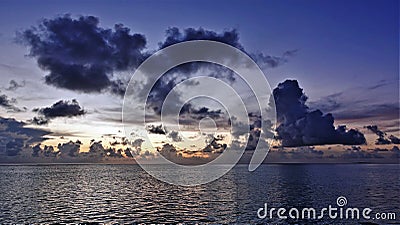 Sky and ocean after sunset. The sun disappeared beyond the horizon, twilight. Stock Photo