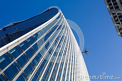 Sky, office building and Airplaine Stock Photo