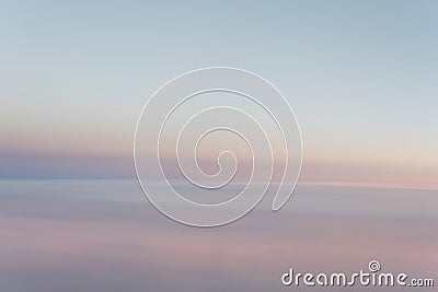 Sky in the pink and blue colors from aiplane window. Stock Photo