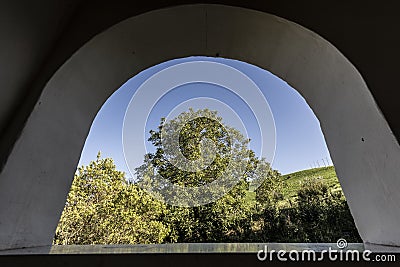 Sky and tree view trough aa small arch Stock Photo