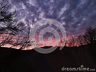 Sky Trees Hills Evening Sunset With Heavy Clouds Stock Photo