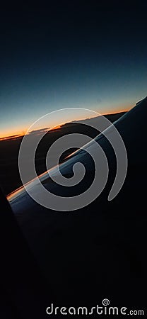 Sky view sunset clouds plane Editorial Stock Photo