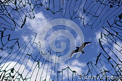 Sky viewed from shattered window glass Stock Photo