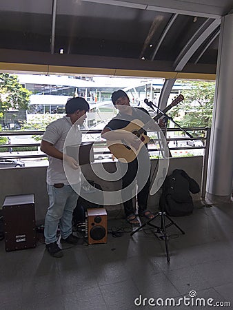 Sky Walk Chong Nonsi BANGKOK,THAILAND-17 AUGUST 2018: Singers, musicians are playing music for donations. on,17 AUGUST 2018, in Editorial Stock Photo