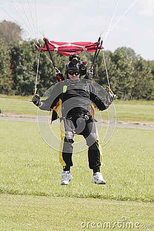 Skydive cameraman coming into land Stock Photo