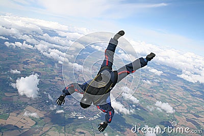 Skydiver dives down Stock Photo