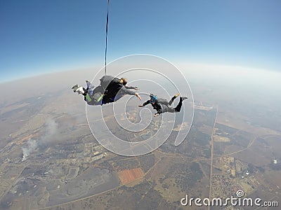 Skydiver films tandem skydive Stock Photo