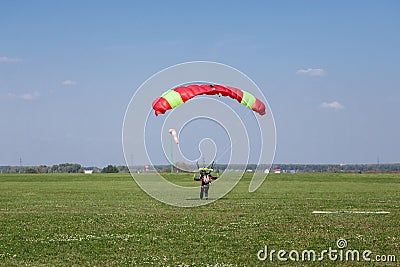 Skydivers parachutist on blue sky on sunset Stock Photo