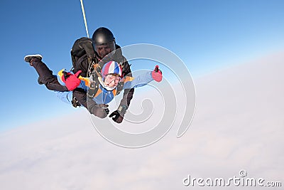 Skydiving. Tandem jump. Two skydivers are in the sky. Stock Photo