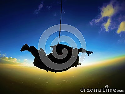 Skydiving tandem sunset silhouette Stock Photo