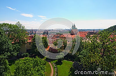 Skyline aerial view of old town Prague, ancient buildings and red tile roofs against blue sky Stock Photo