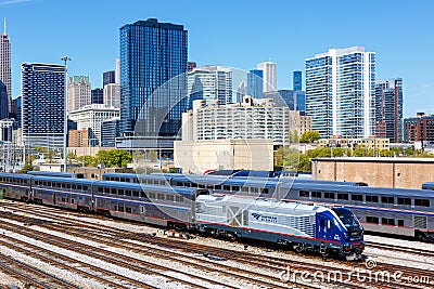 Skyline with Amtrak Midwest passenger train railway near Union Station in Chicago, United States Editorial Stock Photo