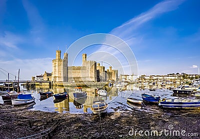 The skyline of Caernafon in Wales during low tide - United Kingdom Stock Photo