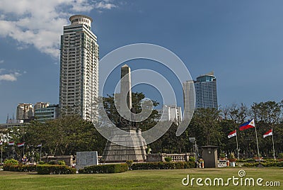 Skyline of Central Manila seen from Rizal Park Stock Photo