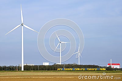 Skyline of Coevorden, windmills, train, factory Editorial Stock Photo