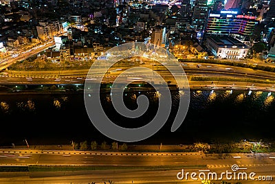 Skyline of Ho Chi Minh city by night with trails of lights, Vietnam Editorial Stock Photo