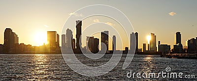 Skyline of Jersey City during sunset as seen from Manhattan, New York City. Stock Photo