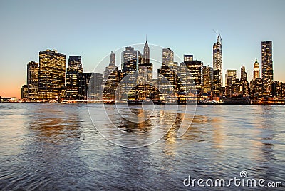 Breathtaking view of skyline of Manhattan at sunset, closed to night. Nice view since Brooklyn Editorial Stock Photo