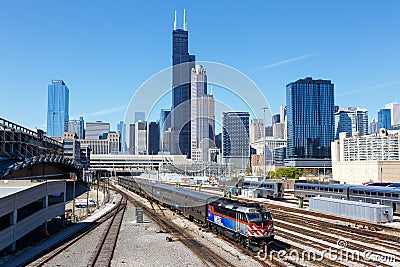 Skyline with METRA commuter rail train public transport near Union Station in Chicago, United States Editorial Stock Photo