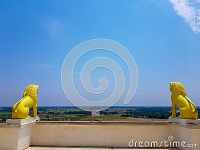 Skyline of odisa and golden lion statues at theview point of dhauli shanti stupa at odisha,India Stock Photo