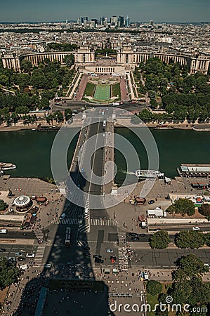 Skyline, River Seine with boats, Trocadero and Eiffel Tower shadow under blue sky in Paris. Stock Photo