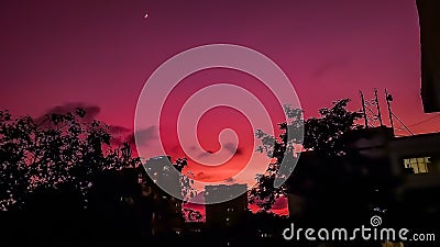 Skyscape and beautiful sky with gradient of colours and tiny moon Stock Photo