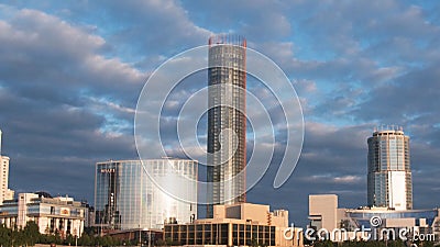 Skyscraper Buildings and Sky View Timelapse. Modern building with cloud in the evening Editorial Stock Photo