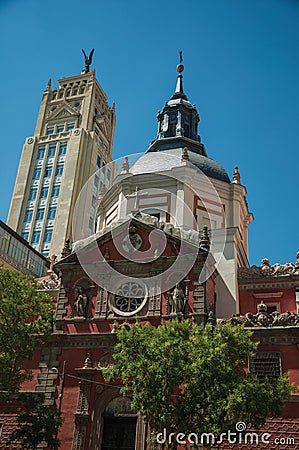 Skyscraper and church facade with dome in Madrid Stock Photo