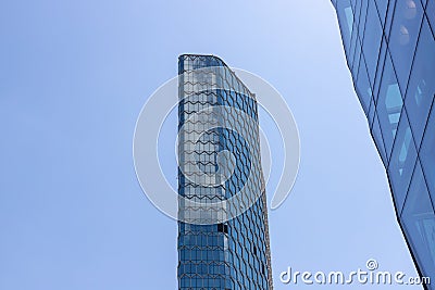 Skyscraper is a high-rise building. A business center that will take your business to heaven. If you need fresh air, you Stock Photo