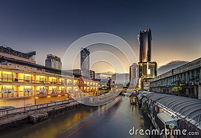 Skyscraper and Pratunam pier in Bangkok; water transportation by Editorial Stock Photo