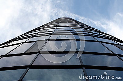 Skyscraper and the Sky - glass building with many windows Stock Photo