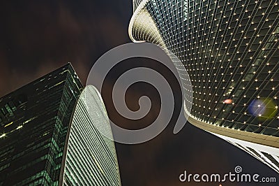 Skyscrapers against the dark sky. two high-rise buildings, the night sky. Modern office buildings. Stock Photo