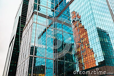 Skyscrapers in downtown. Modern buildings exterior design and reflection in glass. Stock Photo