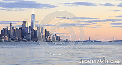 The skyscrapers of New York City Lower Manhattan view from water after the sunset Stock Photo